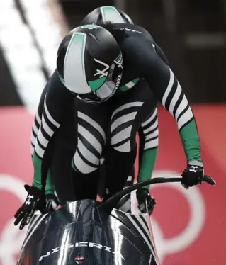  ?? ANDY WONG/THE ASSOCIATED PRESS ?? U.S.-born Nigerians Seun Adigun and Akuoma Omeoga hopped aboard for the first Olympic women’s bobsled run representi­ng an African nation, and emerged none the worse for wear.