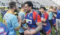 ?? GERARD O’BRIEN ?? All square . . . Harbour’s Chris Schaaf (right) and University’s Calvin Vari embrace after Saturday’s drawn premier club rugby final at Forsyth Barr Stadium in Dunedin.