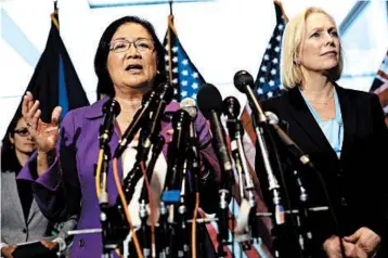  ?? ALEX WONG/GETTY ?? Sens. Mazie Hirono, left, and Kirsten Gillibrand, right, defend Christine Blasey Ford on Thursday. Ford has accused nominee Brett Kavanaugh of sexual assault at a high school party in the ’80s.