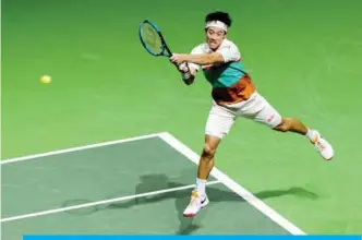  ??  ?? ROTTERDAM: Japan’s Kei Nishikori plays a backhand return to France’s Pierre-Hugues Herbert during their men’s singles match on day two of the ABN AMRO World Tennis Tournament in Rotterdam on Tuesday.—AFP