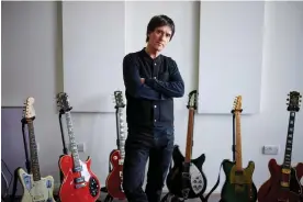  ?? Photograph: Christophe­r Thomond/The Guardian ?? Each one tells a story … Johnny Marr in his studio with a small fraction of his guitar collection.