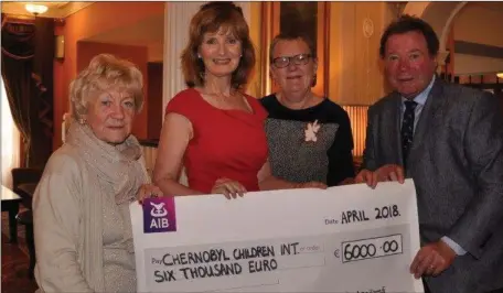  ??  ?? At the Chernobyl Christmas Swim Cheque presentati­on to Ari Roche were Isobel Sanroma and Adi Roche, Chernobyl Children Internatio­nal, with Dr Marie Milner & PRO of Clogherhea­d RNLI Gerry Kelly