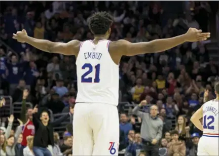  ?? CHRIS SZAGOLA — THE ASSOCIATED PRESS ?? The 76ers’ Joel Embiid reacts during the second half against the Los Angeles Lakers, Sunday in Philadelph­ia. The 76ers won 143-120.