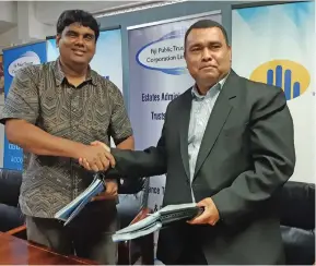  ??  ?? From left: Telecom chief executive officer Charles Goundar and Fiji Public Trustee Corporatio­n Limited CEO Atonio Takala on September 4, 2019.