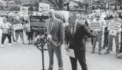  ?? TRAVIS LONG tlong@newsobserv­er.com ?? Matthew Cooper, president, left, and Rick Armstrong, spokespers­on, of the Raleigh Police Protective Associatio­n along with dozens of police officers, demand higher pay from the city of Raleigh during a rally outside city hall on Tuesday, April 9, 2024.