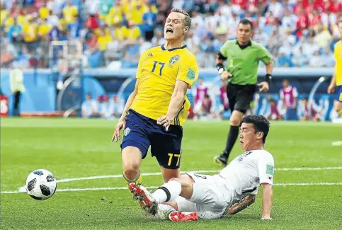  ?? Gallo/Getty 123rf.com/ StephenCob­urn ?? Kim Min-Woo of Korea Republic fouls Viktor Claesson of Sweden, leading to a VAR decision penalty during their match on June 18. Below, The VAR room in the 2018 World Cup Internatio­nal Broadcast Centre.