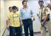  ?? HT ?? Dawood Ibrahim's younger brother Iqbal Kaskar (left) is taken into custody by Thane police in Mumbai late on Monday.