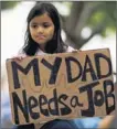  ?? By Joe Raedle Getty Images ?? Occupy Miami: Anabella Campuzano protests on Oct. 15.