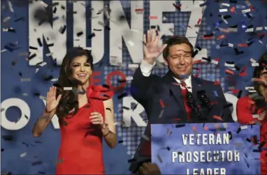  ?? STEPHEN M. DOWELL/ORLANDO SENTINEL VIA AP ?? Ron DeSantis and his wife Casey celebrate after winning the Florida Governor’s race during DeSantis’ party at the Rosen Centre in Orlando, Fla., on Tuesday.