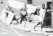  ?? FRANK GUNN
THE CANADIAN PRESS ?? Marco Arop runs from the field to win the men’s 800-metre race Sunday.