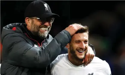  ??  ?? Jürgen Klopp celebrates with Adam Lallana after the midfielder rescued Liverpool from defeat against Manchester United in October. Photograph: Martin Rickett/PA