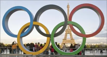  ?? The Associated Press ?? The Olympic rings are set up at Trocadero plaza that overlooks the Eiffel Tower in Paris, France, in 2017. The government­s of more than 30 nations released a letter Monday, calling on the IOC to clarify the definition of “neutrality” as it seeks a way to allow Russian and Belarusian athletes back into internatio­nal sports and, ultimately, next year’s Paris Olympics.