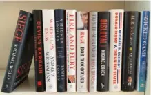  ?? AP PHOTO ?? A collection of books about President Donald Trump are seen.