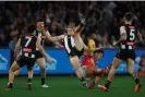  ?? Photograph: Daniel Pockett/Getty Images ?? Murphy falls hard after attempting to mark the ball over Cam Rayner in 2023.