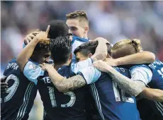  ?? DARRYL DYCK/THE CANADIAN PRESS ?? Whitecaps’ Yordy Reyna, far left, celebrates his goal with Aly Ghazal, Cristian Techera, Jake Nerwinski, Fredy Montero and Marcel de Jong during Saturday’s game against Colorado.