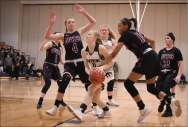  ?? ERIC BONZAR — THE MORNING JOURNAL ?? Elyria Catholic’s Julia Allegretto is fouled by Wellington guard Jalen Gibbs (10) as she drives to the basket.