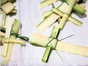  ?? ?? Palm crosses and palm fronds will be given out to the faithful on Palm Sunday.