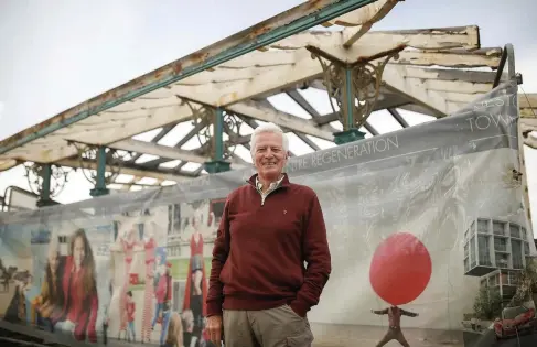  ??  ?? John CrockfordH­awley, pictured in front of one of the soon-to-berestored seafront shelters