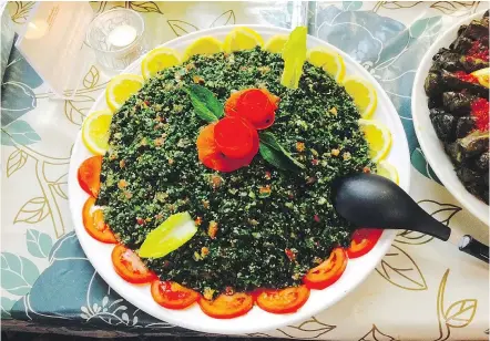  ?? — photos: Mia Stainsby ?? Tabbouleh was one of the dishes prepared at the dinner.