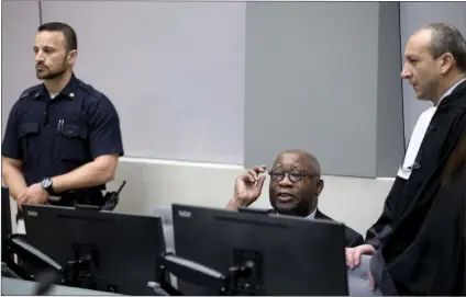  ?? Picture: REUTERS ?? ‘VICTIM OF A PLOT’: Ex-Ivory Coast president Laurent Gbagbo, centre, and his lawyer Emmanuel Altit , right, wait for the start of the trial at the Internatio­nal Criminal Court in The Hague. The ICC’s prosecutor vowed to ‘leave no stone unturned’ in investigat­ing alleged crimes committed by all sides in Ivory Coast’s brief 2010 civil war. But the writer says evidence against Gbagbo was fabricated and a human rights violation.