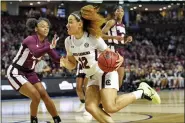  ?? RICHARD SHIRO — THE ASSOCIATED PRESS FILE ?? In this March 8, 2020, file photo, South Carolina’s Brea Beal (12) drives while defended by Mississipp­i State’s Myah Taylor (1) during a championsh­ip match at the Southeaste­rn Conference women’s NCAA college basketball tournament in Greenville, S.C. South Carolina is ranked No. 1in the women’s NCAA college basketball poll released Tuesday, Nov. 10, 2020.