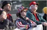  ?? SHANNON STAPLETON / REUTERS ?? Supporters of US President-elect Donald Trump attend an pre-inaugural concert at the Lincoln Memorial in Washington on Thursday.