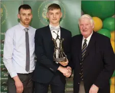  ??  ?? Hurler of the year Luke Reynolds with sponsor Ian Whyte, of Ian Whyte Motors Kilpeddar, and Mick Hagan.