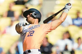  ?? YANKEES ABBIE PARR/AP ?? Jasson Dominguez connects for a home run during the third inning of the MLB All-star Futures game against the National League on July 16 in Los Angeles.