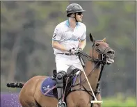  ?? ALLEN EYESTONE / THE PALM BEACH POST ?? Prince Harry plays in a polo match for his charity, Sentebale, on May 4.