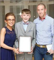  ??  ?? NF Fighter of the Year Shannon Brady, left, with her brother Danny Brady and Gareth Curran head of the NF Associatio­n at the organisati­on’s recent ball at the Listowel Arms Hotel.