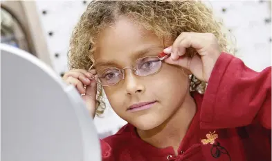  ??  ?? Children may be resistant to the idea of wearing glasses, but whether they are distance learning from home or are physically in the classroom — or a combinatio­n of the two — optimal vision is essential to the learning process.
