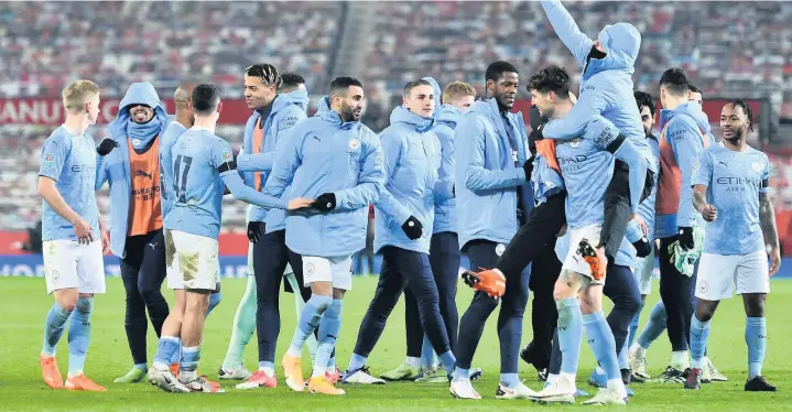  ?? Picture: Peter Powell/Getty ?? Manchester City players celebrate after beating Manchester United 2-0 in Wednesday night’s Carabao Cup semi-final at Old Trafford