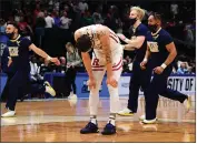  ?? EMILEE CHINN — GETTY IMAGES ?? Rutgers’ Caleb Mcconnell shows his disappoint­ment after losing to Notre Dame in double overtime Wednesday night.