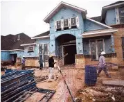  ?? Jerry Baker ?? Trendmaker Homes is at work on a new home along Driftwood Harbor in Lakes at Creekside in Tomball.