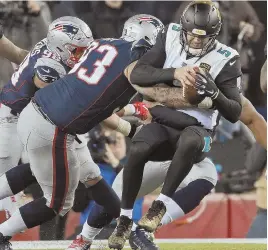  ?? STAFF PHOTO BY MATT STONE ?? CRUNCHED: Lawrence Guy sacks Blake Bortles during the third quarter of the Patriots’ AFC Championsh­ip Game win yesterday.