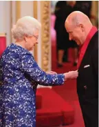  ??  ?? Trusted aide: The Queen honours Sir Christophe­r Geidt in 2014