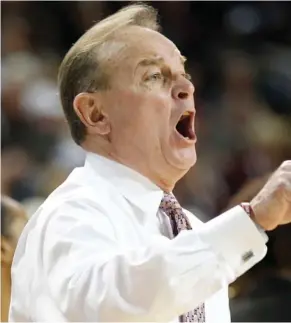  ?? (Photo by Rogelio V. Solis, AP) ?? Mississipp­i State women's basketball coach Vic Schaefer directs his team during an earlier game this season.