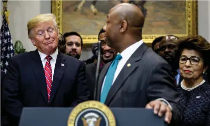  ??  ?? The South Carolina senator Tim Scott, center, speaks as Donald Trump and Jovita Carranza listen in the White House, on 12 December 2018. Photograph: Brendan Smialowski/AFP/Getty Images