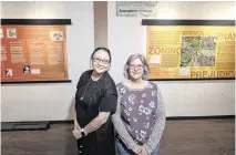  ?? ANDY ALFARO aalfaro@modbee.com ?? History professors Eva Mo, left, and Eileen Kerr stand with a display in Founder’s Hall of research conducted by students that shows Modesto’s history of segregatio­n, the lost Chinatown, & Dust Bowl refugees in the Airport District.