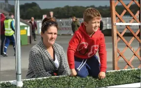  ??  ?? Jennifer Lyons and Rhys Keane getting a good view of the action on the turf on Monday at the Listowel Races.