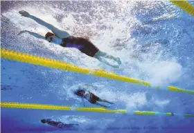  ?? Tom Pennington / Getty Images ?? Lilly King leads the pack and the world with her time of 29.66 seconds in the 50-meter breaststro­ke, 0.22 of a second faster than her Russian rival.