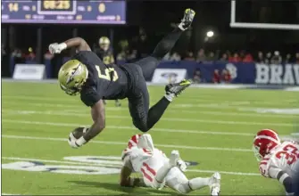  ?? PHOTO BY SAM GANGWER ?? St. John Bosco running back Chauncey Sylvester gets flipped into the air by Mater Dei's Jeilani Davis on Friday.
School: Millikan
Sport: Football
Year: Senior
Noteworthy: