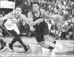  ?? — USA TODAY Sports photo ?? Toronto Raptors guard Kyle Lowry dribbles the ball past San Antonio Spurs guard Bryn Forbes in the first half at Air Canada Centre.