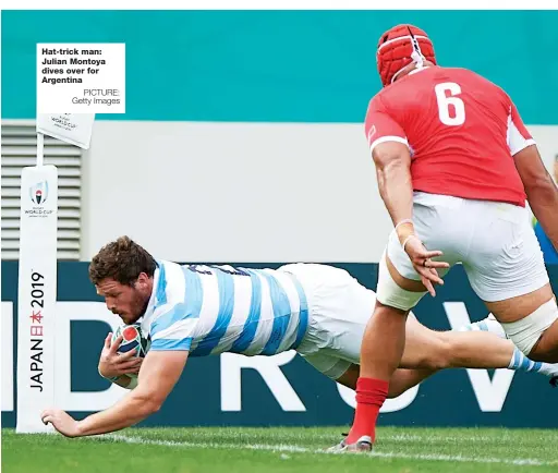  ?? PICTURE: Getty Images ?? Hat-trick man: Julian Montoya dives over for Argentina