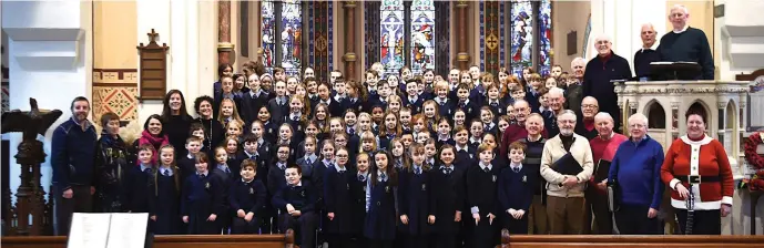  ?? Photos by Michelle Cooper Galvin ?? St Oliver’s National School choir with members of the Killarney Golf Club Men’s Choir Noel O’Sullivan Producer, Musical Directors Russ Browne, Josephine Doncel, Noreen Coffey, Catherine Doyle and Shirley McGough at the Christmas CD recording in St Mary’s Church, Killarney on Monday.