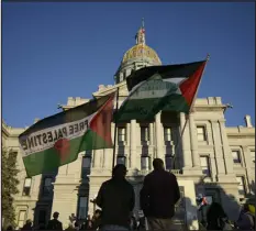  ?? HYOUNG CHANG — DENVER POST FILE ?? About 1,000people join in a demonstrat­ion for the Internatio­nal Day of Action to demand an immediate cease-fire in the Gaza Strip and an end to U.S. aid to Israel in front of the Colorado State Capitol in Denver on Nov. 9.