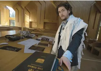  ?? ROBERT BUMSTED/AP ?? Rabbi Joshua Franklin stands inside the sanctuary Feb. 10 at the Jewish Center of the Hamptons in East Hampton, N.Y. Franklin experiment­ed with writing a sermon for his congregati­on using artificial intelligen­ce software ChatGPT.