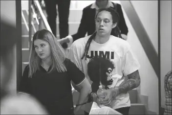  ?? ALEXANDER ZEMLIANICH­ENKO/AP ?? WNBA STAR AND TWO-TIME OLYMPIC GOLD MEDALIST Brittney Griner is escorted to a courtroom for a hearing, in Khimki just outside Moscow, Russia, on Friday.