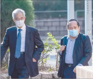  ?? Photo: Nampa/AFP ?? Hong Kong Veteran activists Martin Lee (L) and Albert Ho (R) arrive at the West Kowloon Magistrate­s Court in Hong Kong on Tuesday as they go on trial for organising one of the biggest democracy protests to sweep the city in 2019.