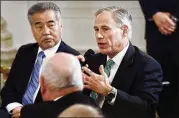  ?? OLIVIER DOULIERY / ABACA PRESS ?? Texas Gov. Greg Abbott (right) speaks at the White House Business Session with the nation’s governors on Monday in the State Dinning Room of the White House in Washington.